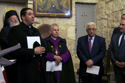 The Very Rev. Hosam Naoum, dean of the St. George’s Cathedral, Anglican Bishop in Jerusalem Suheil S. Dawani and Palestinian Authority President Mahmoud Abbas and Prime Minister Salam Fayyad during a service of Lessons and Carols at the Church of the Nativity in Bethlehem on Dec. 24. ENS Photo/Lynette Wilson